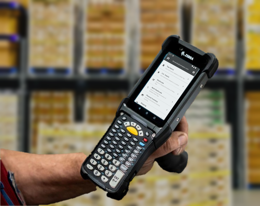 Warehouse worker holding a Zebra handheld running WMS Mobile tag and location tools